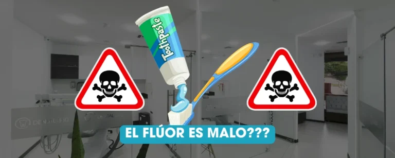 Pasta dental con flúor sobre un cepillo junto a señales de advertencia en una clínica dental