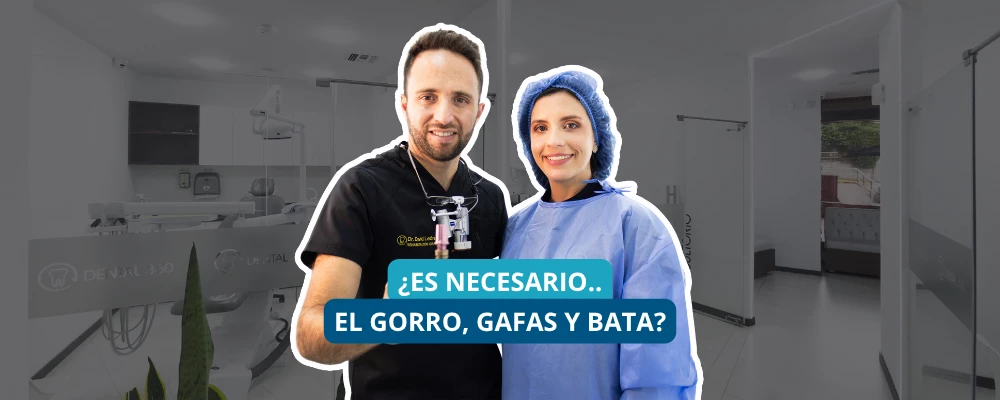 Odontólogos usando elementos de bioseguridad como gorro, gafas y bata para proteger al paciente en consulta dental